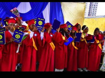 Zagol Academy 8th grade graduates with certificates